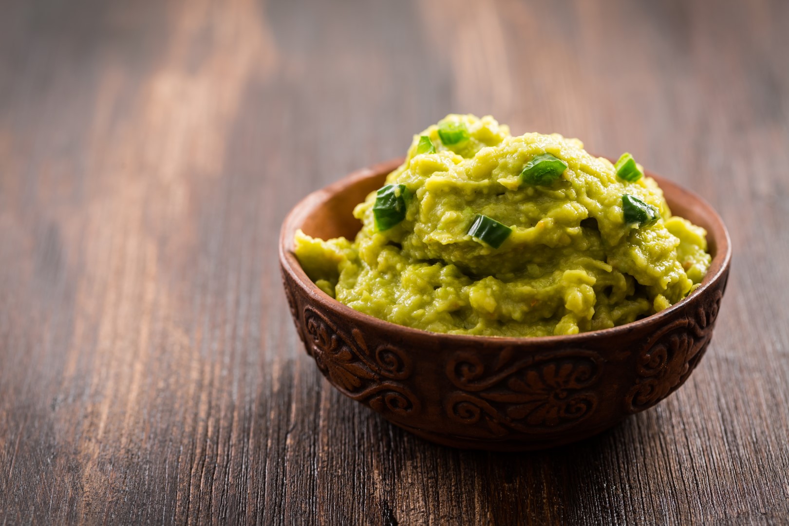 Guacamole on wooden table